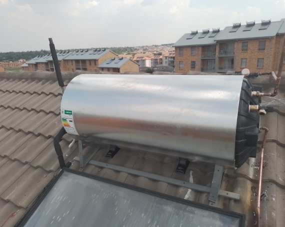 carpenter-drilling-a-hole-in-a-board-in-a-room-wit-YTPTJAC